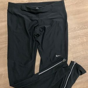 Nike black long leggings with zippers at ankle